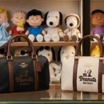 Cartera Coach con correa y agarradera de Snoopy