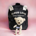 Mochila pequeña color negra con peluche