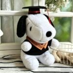 Peluche Snoopy graduado